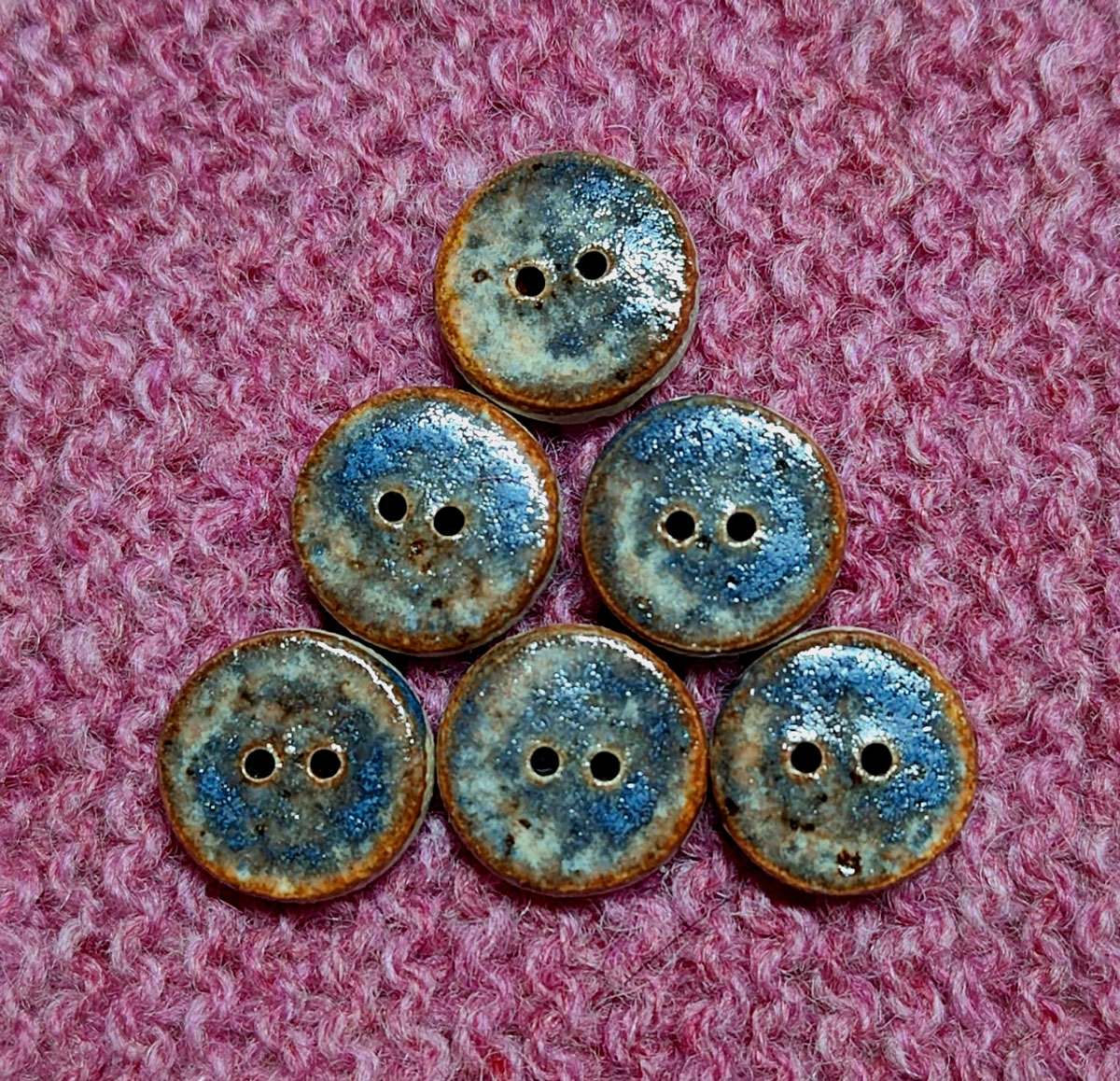 Buttons on a pink knit