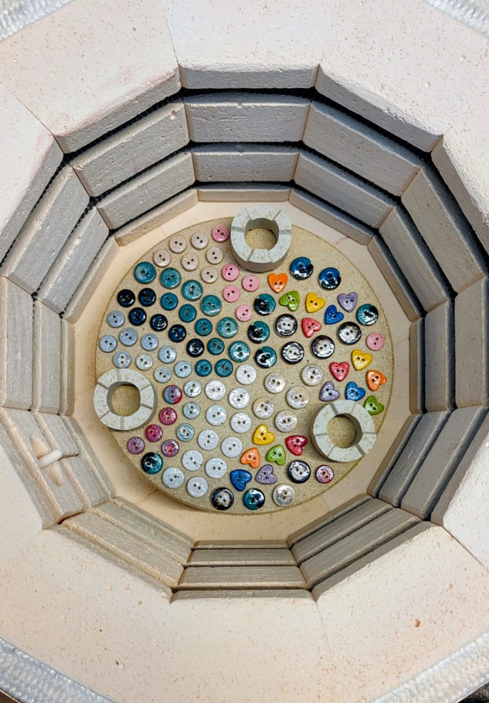 Buttons in the kiln